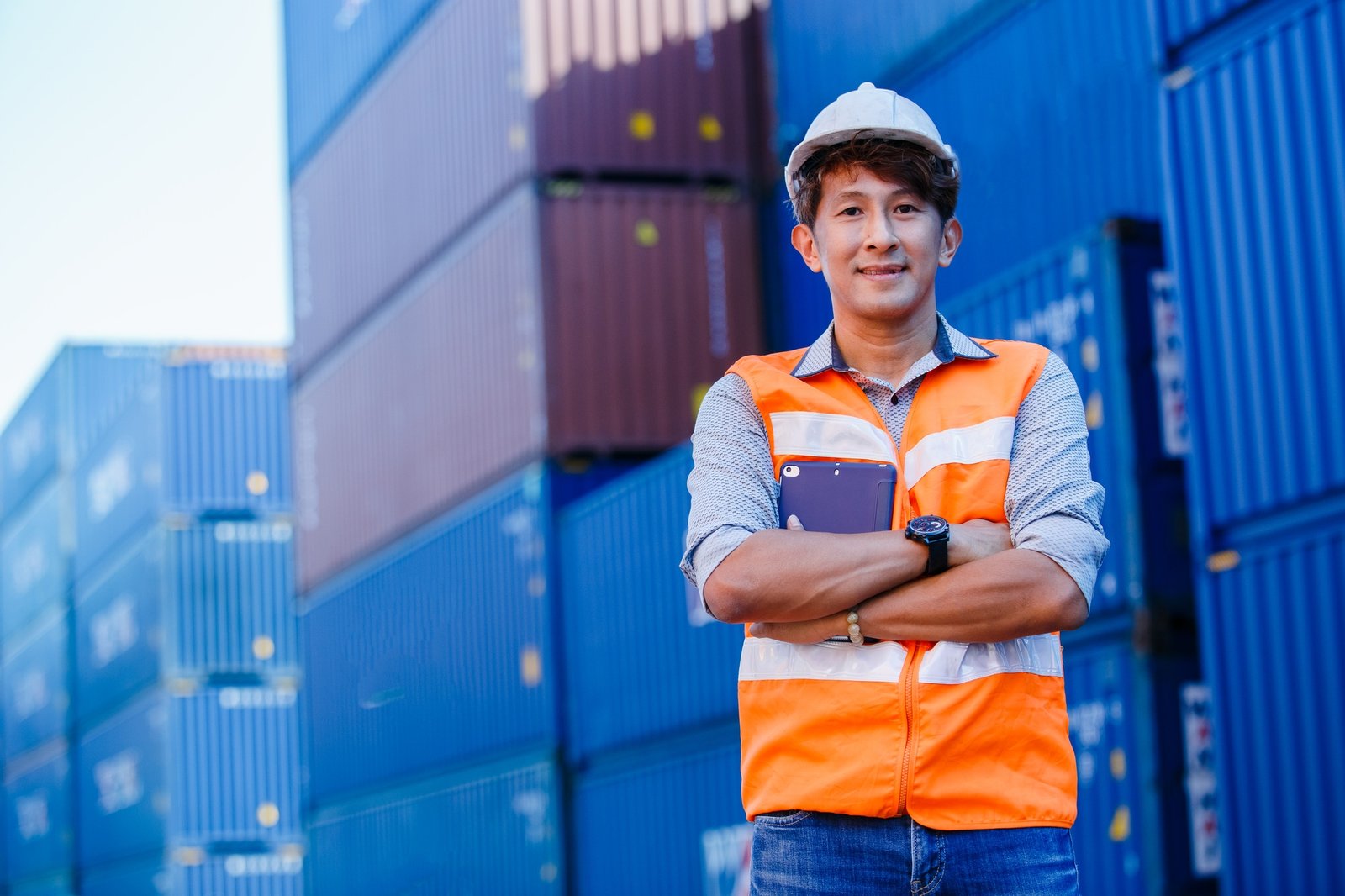 portrait of asian man smiling engineer arm crossed